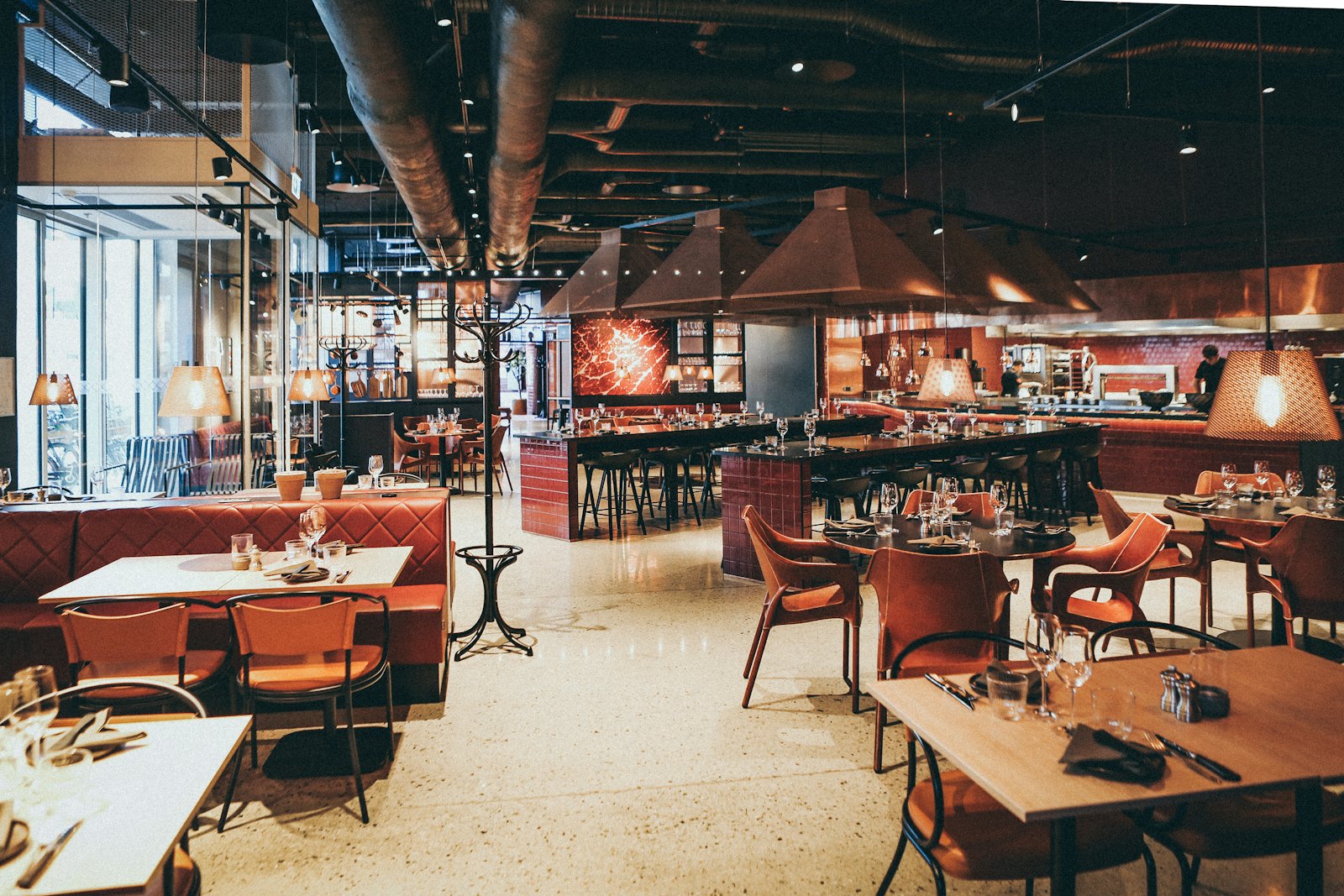 A warm restaurant interior with guests